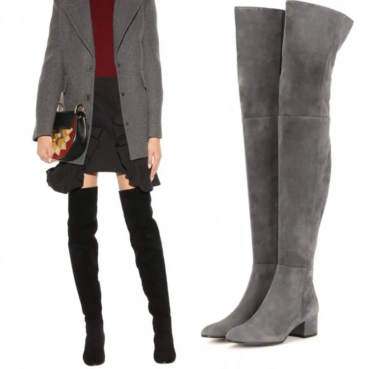 Grey suede women's over-the-knee flat boots with a low chunky heel and pointed toe.