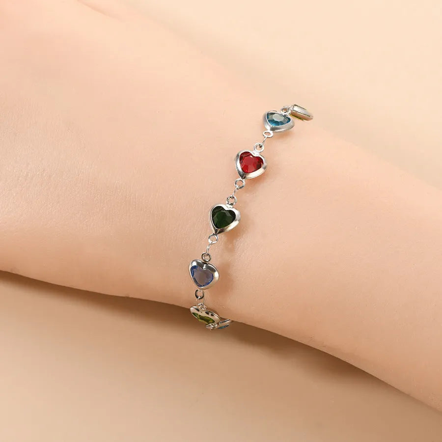 Devil's Eye geometric heart-shaped stainless steel bracelet in one of six colour options on a wrist.