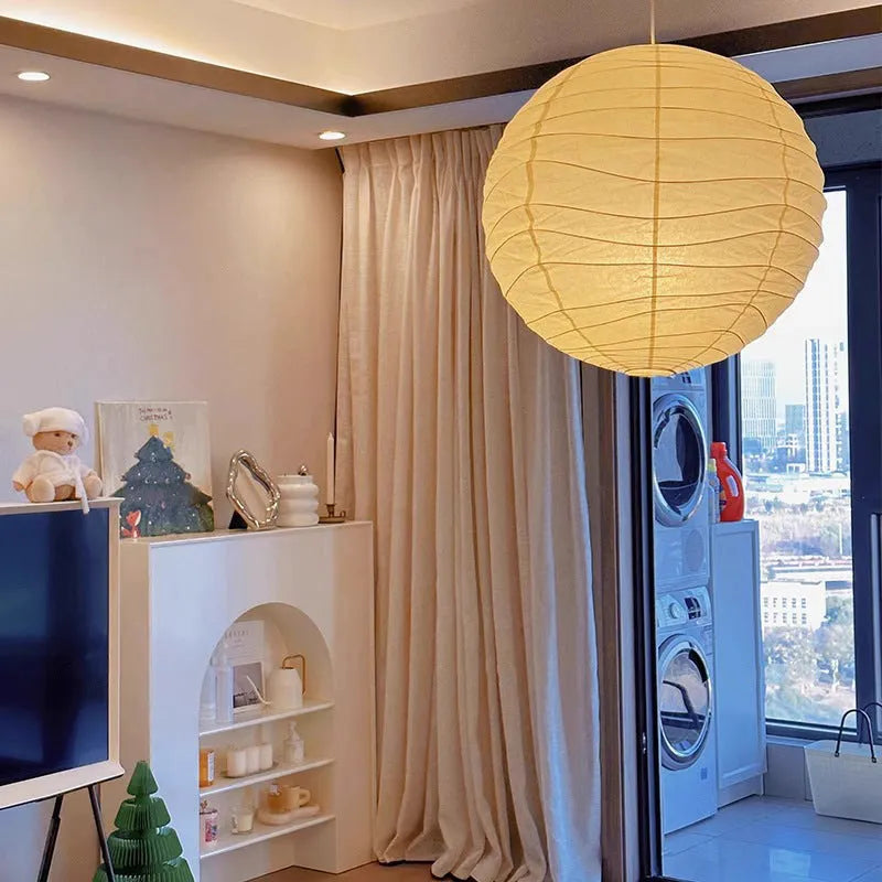 Japanese style rice paper pendant chandelier with soft glowing light.