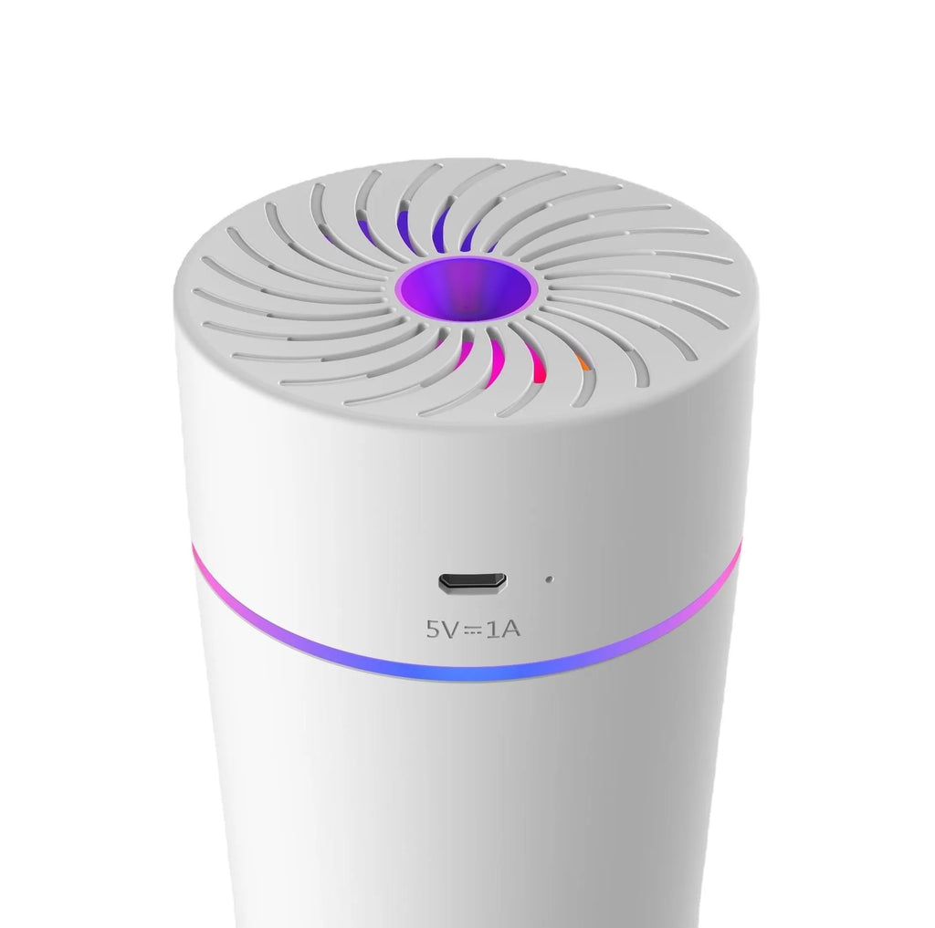 Compact white car USB mini humidifier with aromatherapy function positioned in vehicle cup holder