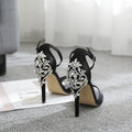 Black suede women's high heels with rhinestone decoration and a fish mouth toe.