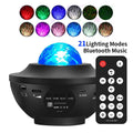 Black desktop projection lamp showing starry sky patterns with water ripple laser effects