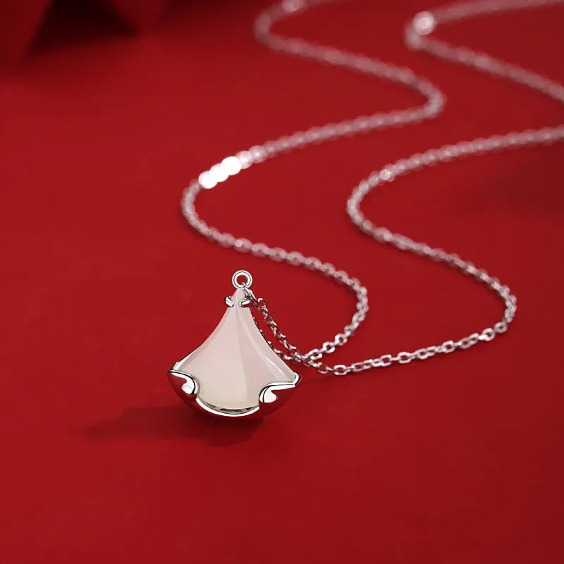 S925 sterling silver Hetian jade skirt pendant necklace on display with 40cm chain