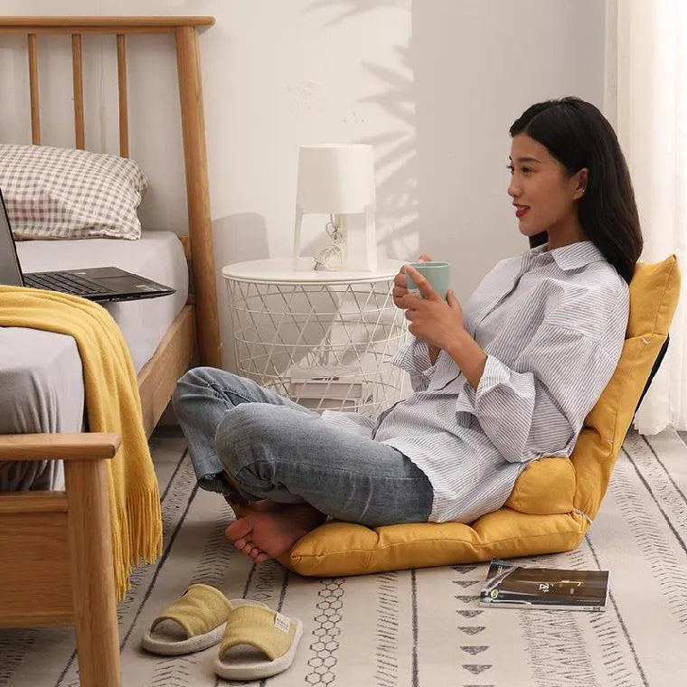 Adjustable floor lazy sofa in beige with 6-level backrest and high-elastic-sponge filling, shown in living room
