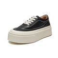 Women's black embossed cowhide leather platform sports board shoes with a round toe and white rubber sole.