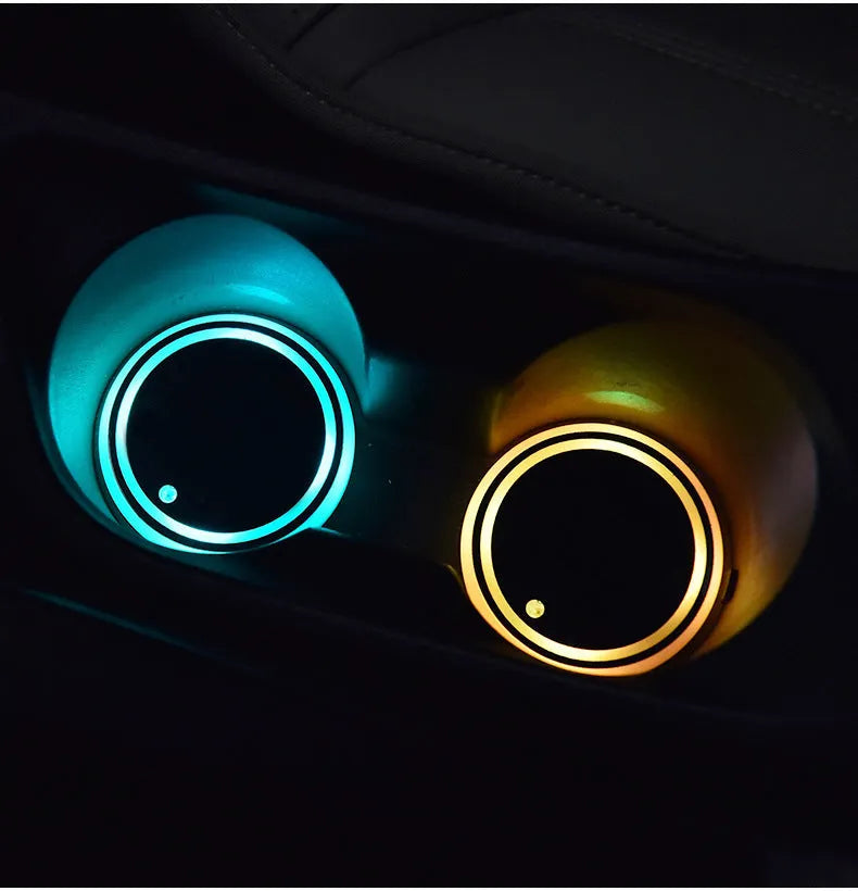 Colourful LED light-up coaster for car cup holder showing seven changeable colours and USB cable.