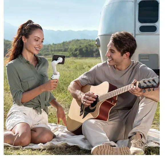 Magnetic mobile phone PTZ gimbal stabiliser with attached smartphone and magnetic clamp