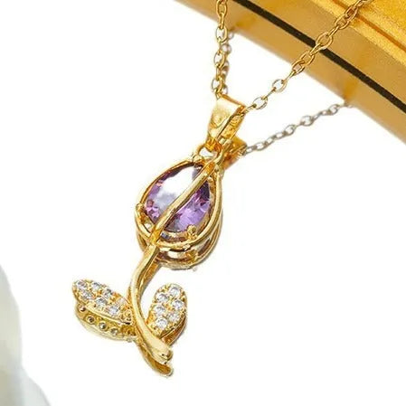 Zircon tulip pendant necklace for women in electroplated gold colours on an adjustable O-ring chain.