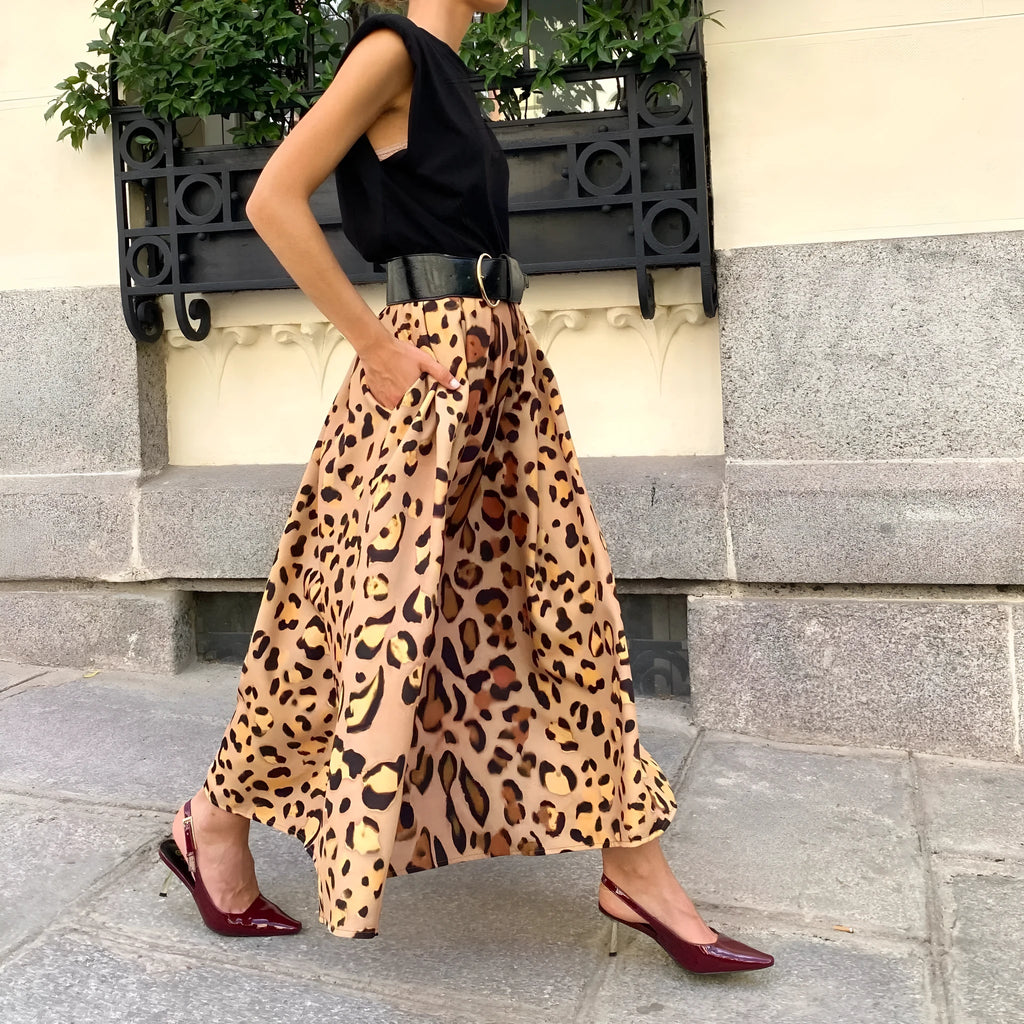 Brown leopard print women's long A-line skirt on a hanger.