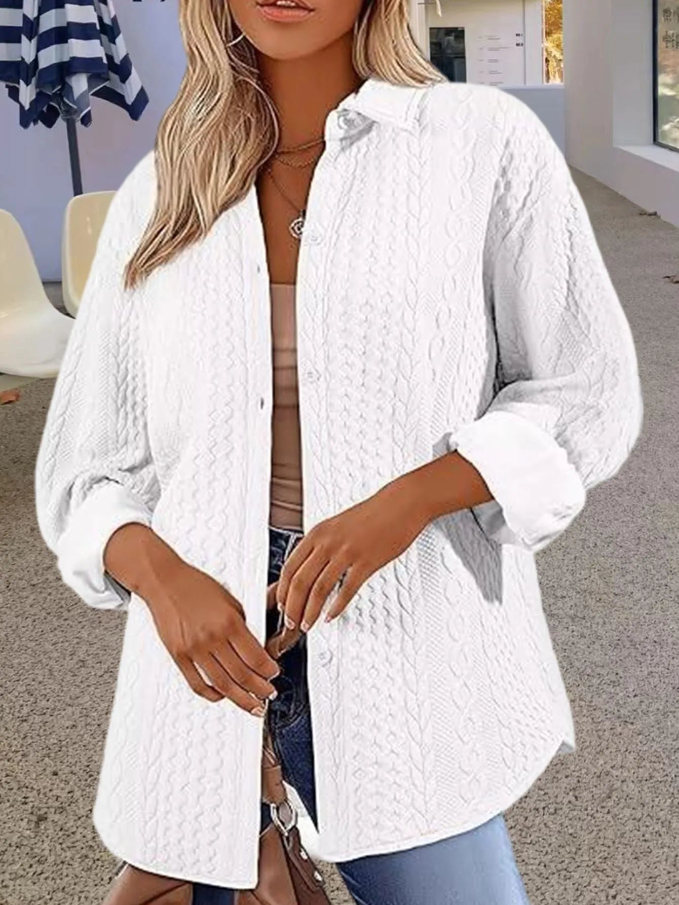 Women's solid colour long sleeve knit cardigan sweater in black, shown on a model.