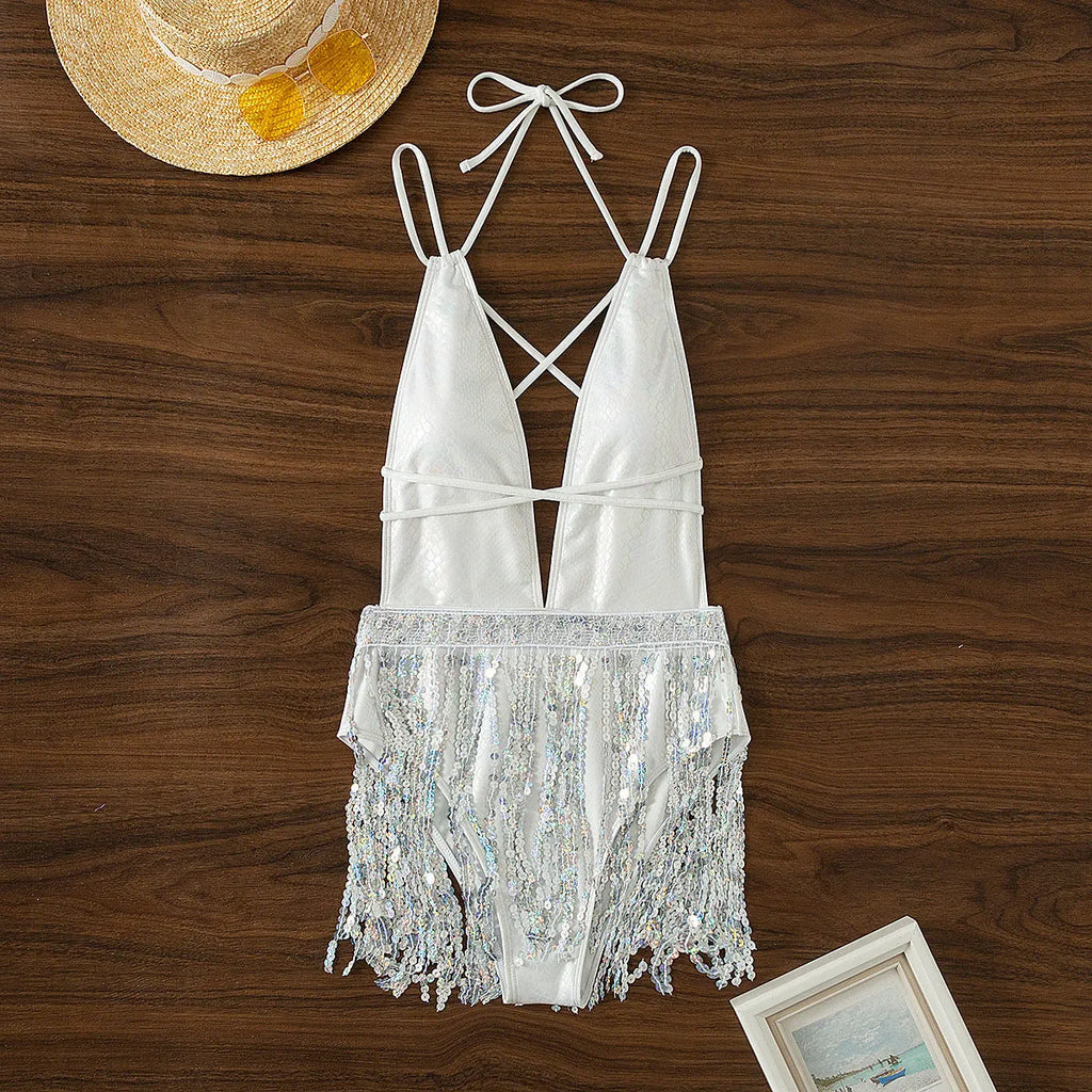 White one-piece swimsuit with deep V-neckline and tassel detailing, sleeveless briefs design
