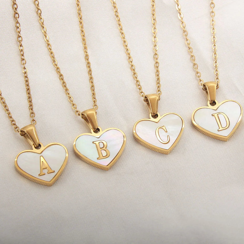 Gold-plated heart-shaped necklace with white shell pendant and personalised initial letter on 45+5cm chain