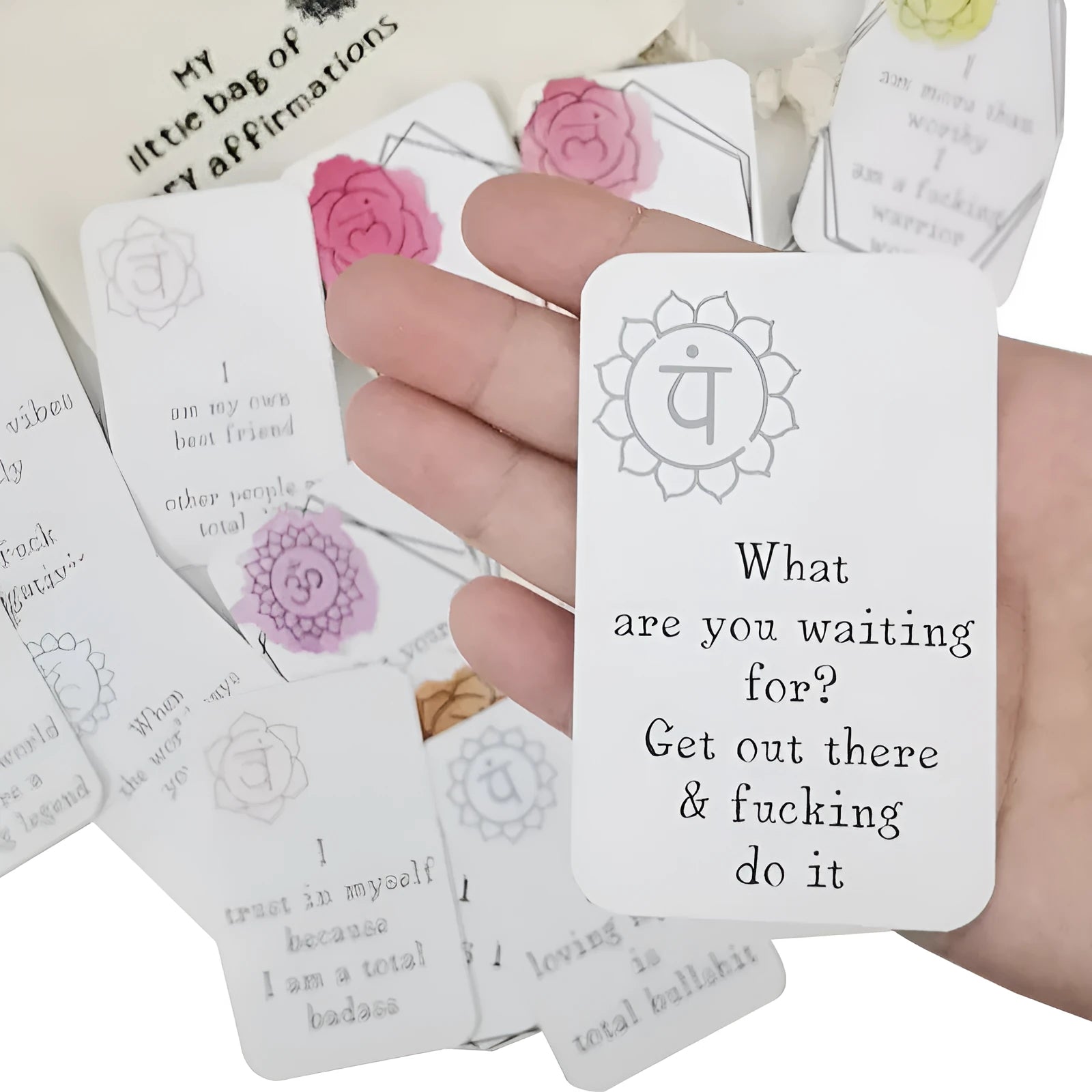 Set of 16 colourful funny affirmation cards with healing messages inside a gift card bag.
