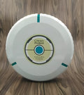 Black or white compact robot vacuum cleaner on a hardwood floor.