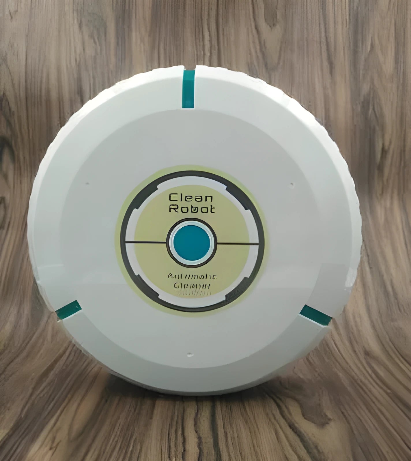 Black or white compact robot vacuum cleaner on a hardwood floor.