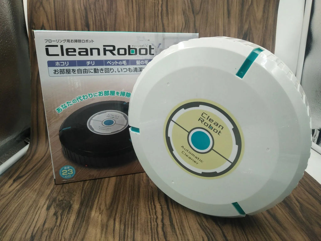 Black or white compact robot vacuum cleaner on a hardwood floor.