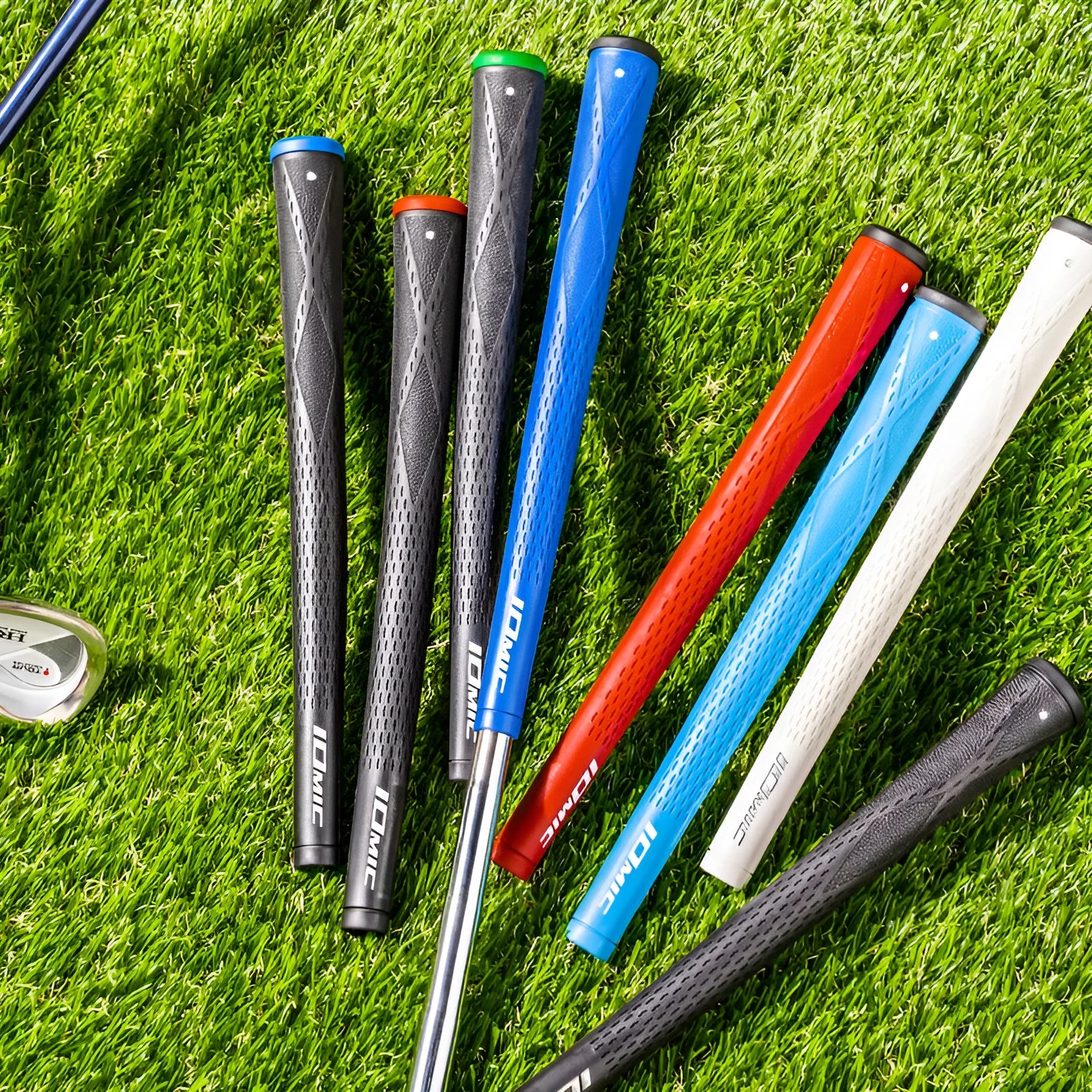 TPE material golf club grip shown in various colours including pink, red, blue, and black with coloured head designs.