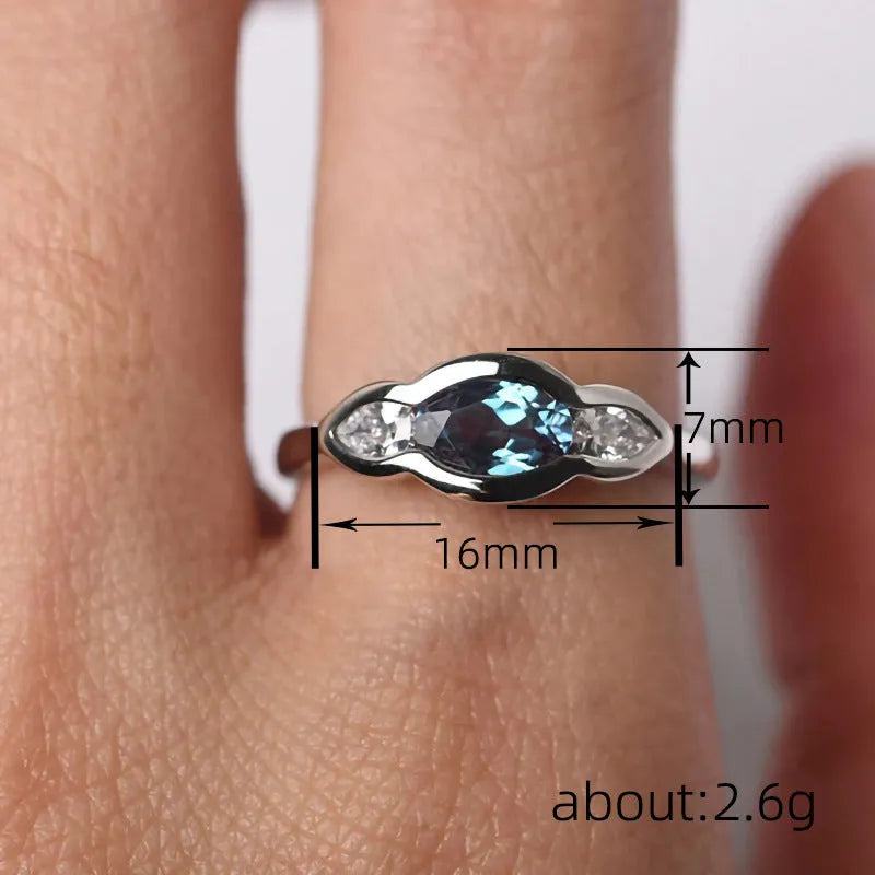 Geometric ellipse zircon ring in white gold finish showing structured design and stone detailing