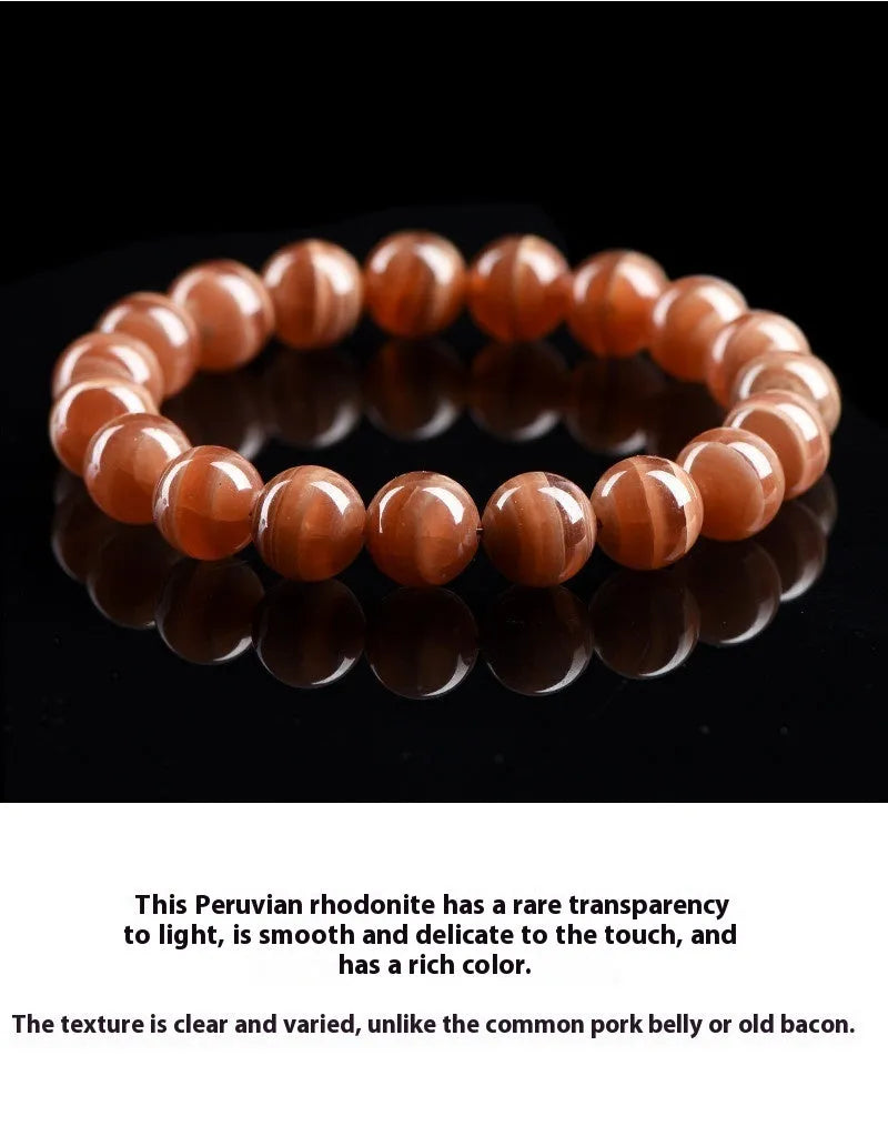 Natural old mine rhodochrosite round bead bracelet with Ruyi charm, Peruvian mineral jewellery.