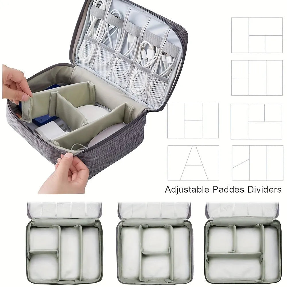 Black travel cable organiser bag open, showing mesh pockets, elastic loops, and removable padded dividers.