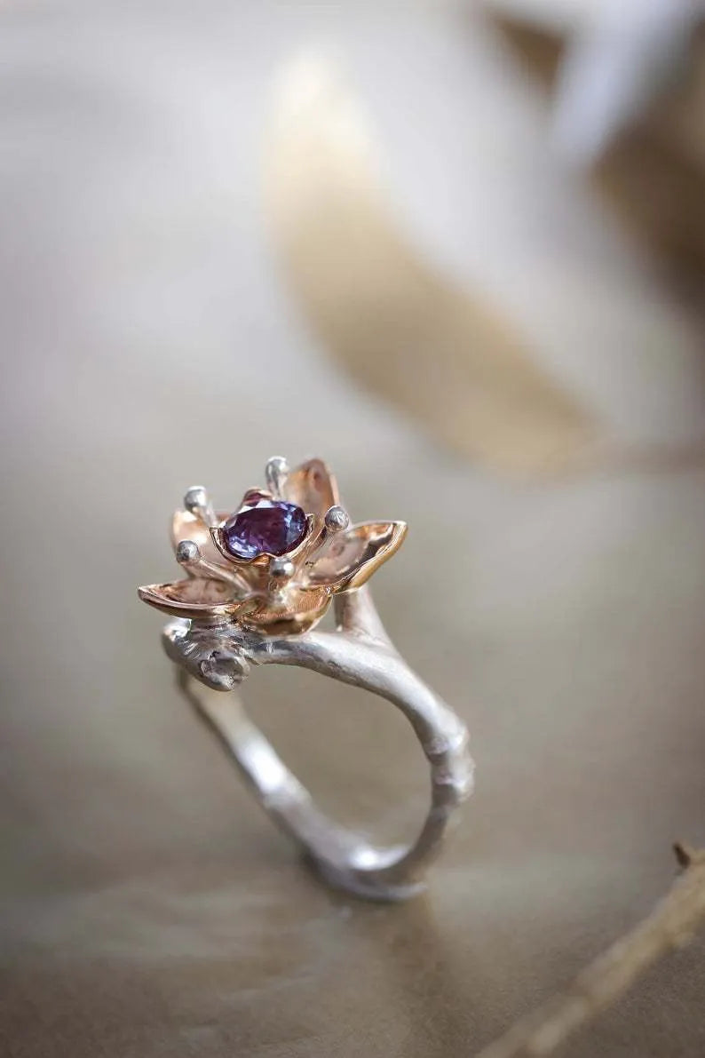 Women's two-tone floral geometric alloy ring in silver colour on display