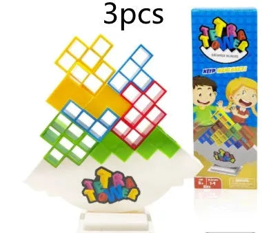 Plastic balance stacking board game with 16 colourful building blocks, a chassis, and a base on a flat surface.