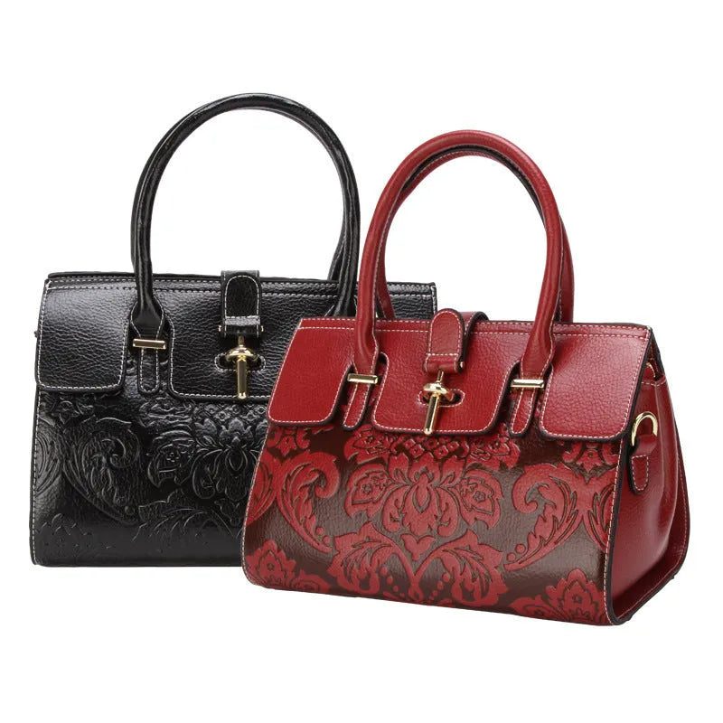 Red vintage women's crossbody leather bag with embossed pattern and multiple internal compartments