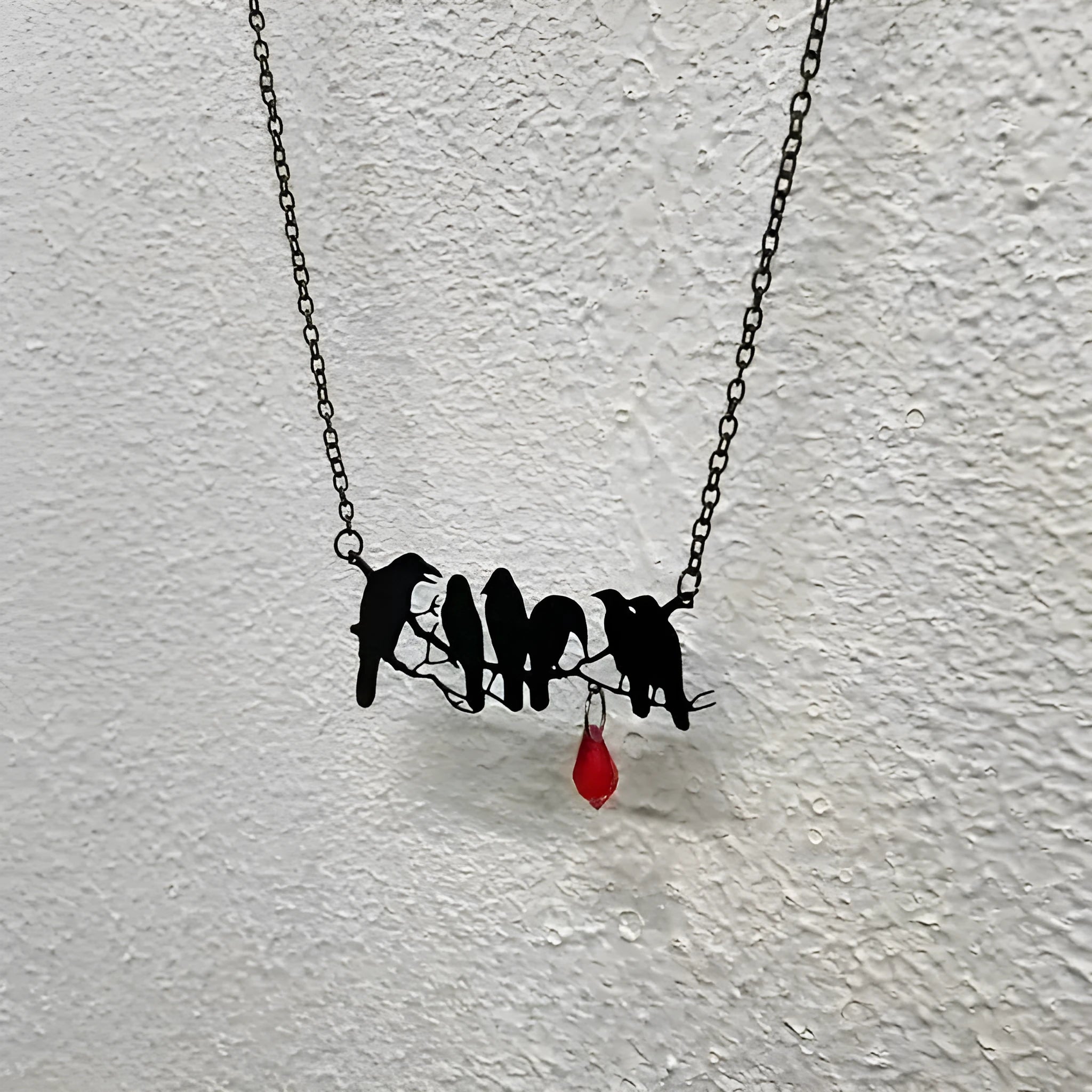 Black crow necklace with bird zodiac pendant on cross chain for women's alternative fashion jewellery