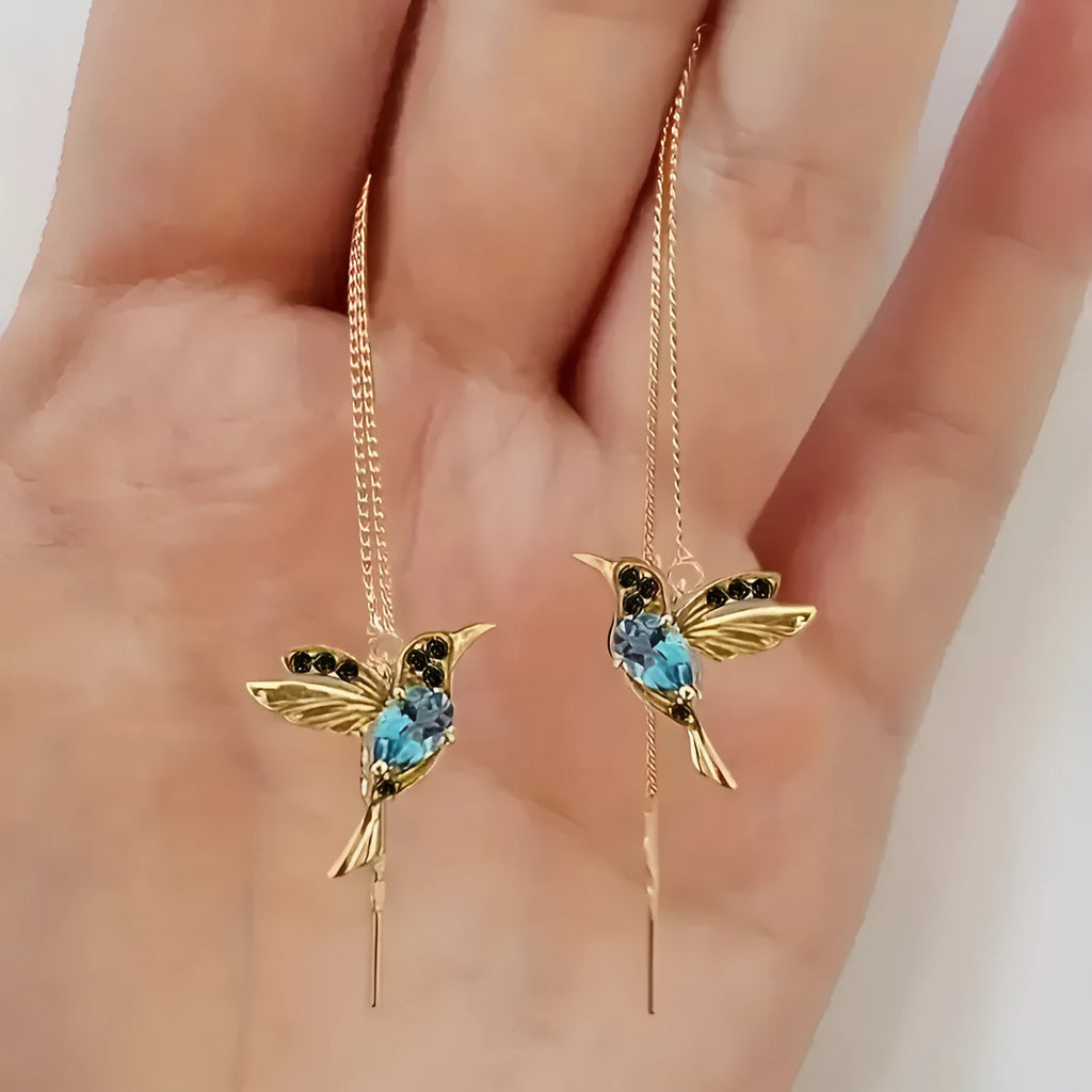 Personalised bird hanging earrings with zirconium wing detail and zodiac animal modelling in long drop style