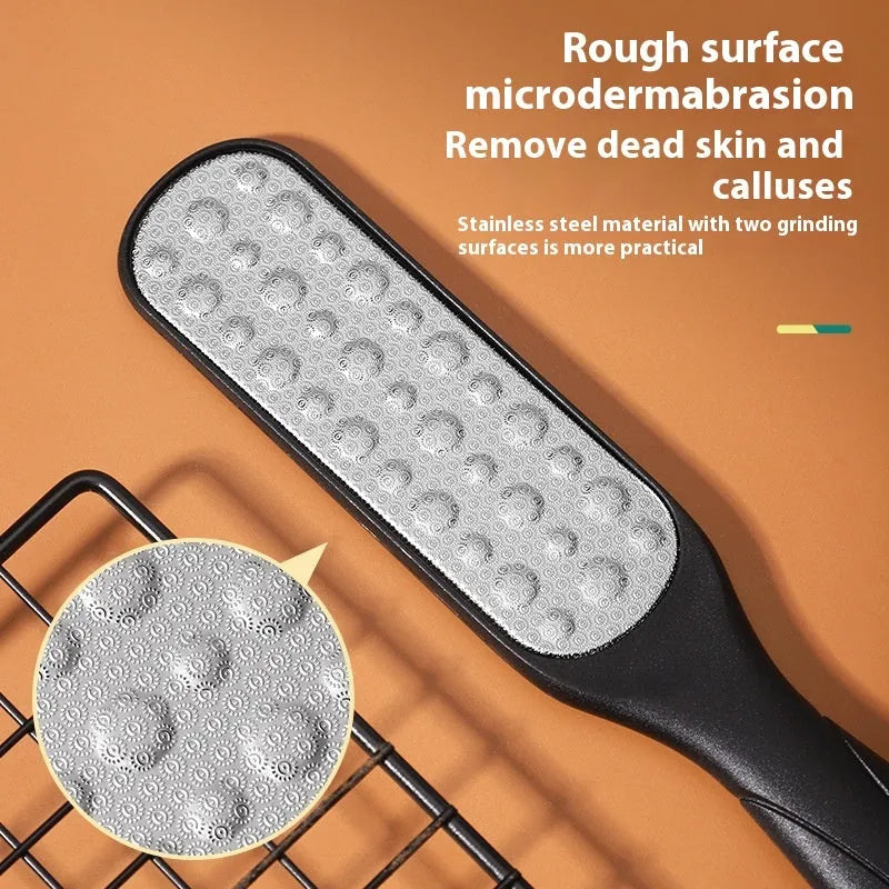 Stainless steel double-sided foot grinder with white and black abrasive heads for callus removal