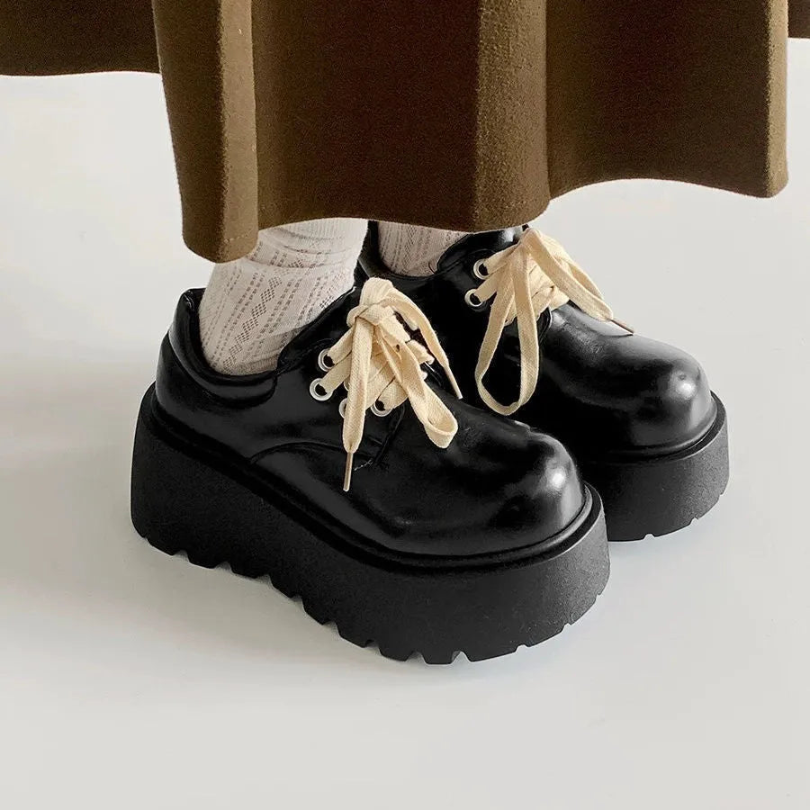 Women's matte black lace-up shoes with thick rubber sole and chunky 6-8cm heel, round toe.