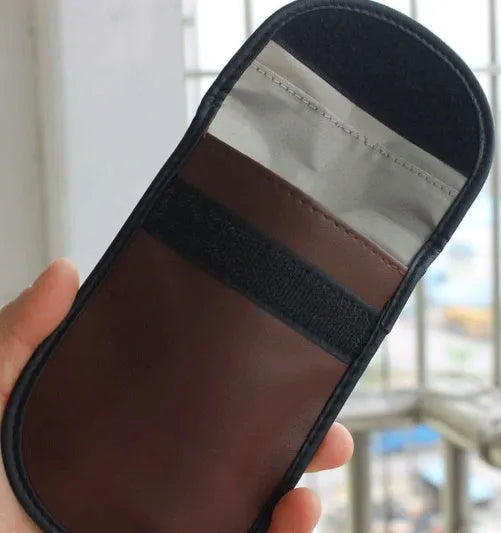 Black microfiber RFID signal blocker bag for phones and cards measuring 13.5 by 9.5 centimetres