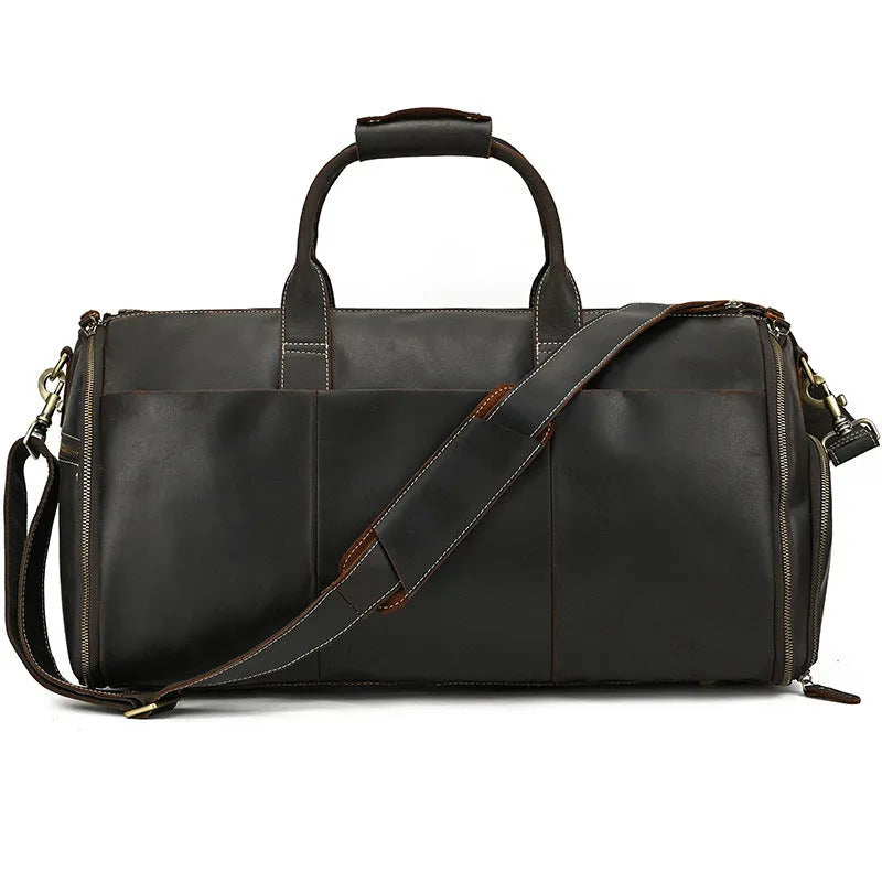 Vintage 22 inch brown leather duffle bag made from top layer cowhide, folding design with zipper closure on plain background
