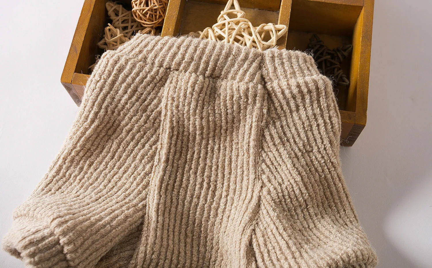Brown cloth dog sweater pullover for small breeds on size chart showing XS to XL