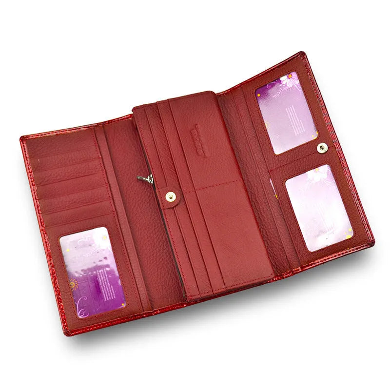 Women's red patent leather coin purse with a crocodile-embossed texture.