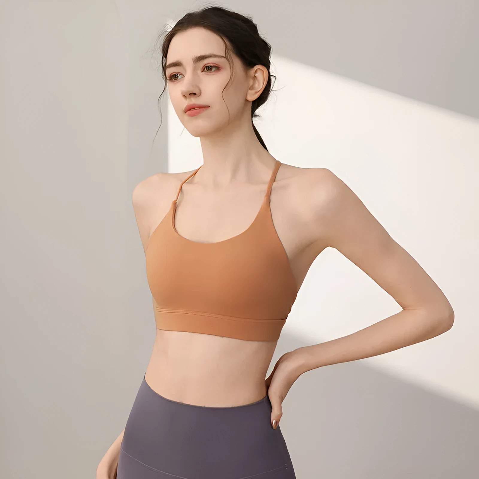 Women's sports vest in nylon with fixed double-shoulder straps for running and workouts.