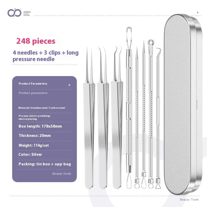 Four silver metal acne needles with pointed tips laid out on a surface.
