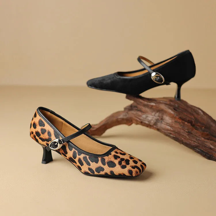 Women's black ankle-strap stiletto heels with a horse hair upper and square toe.