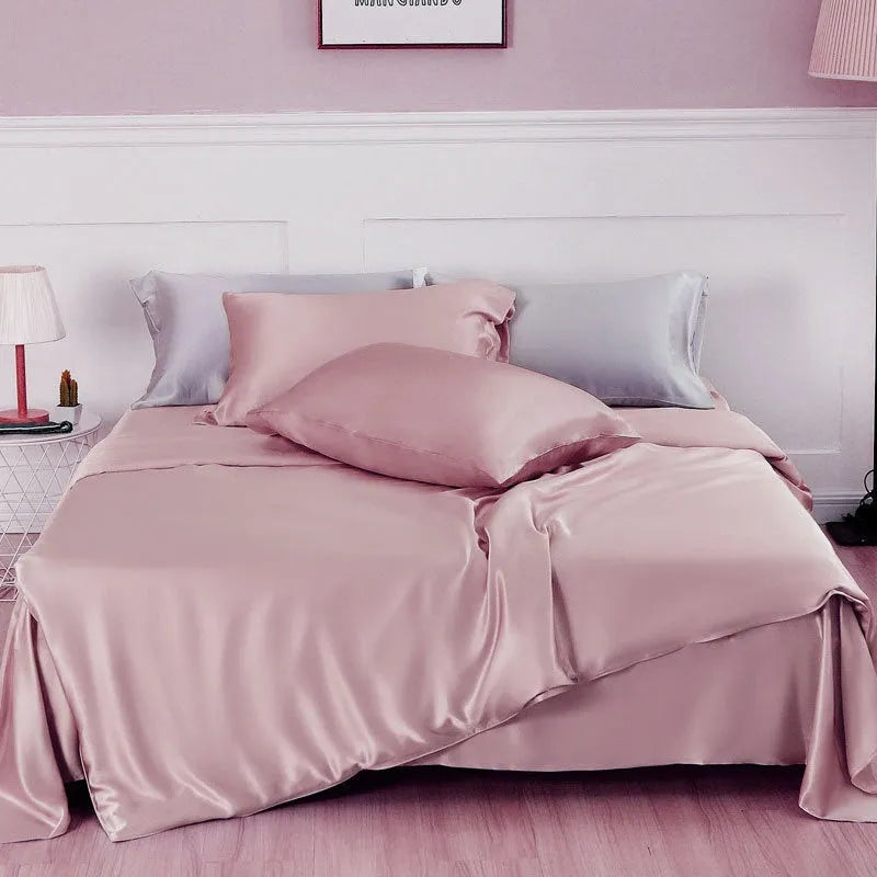 Solid colour silk duvet cover shown in Lotus Pink, double-sided design on a bed