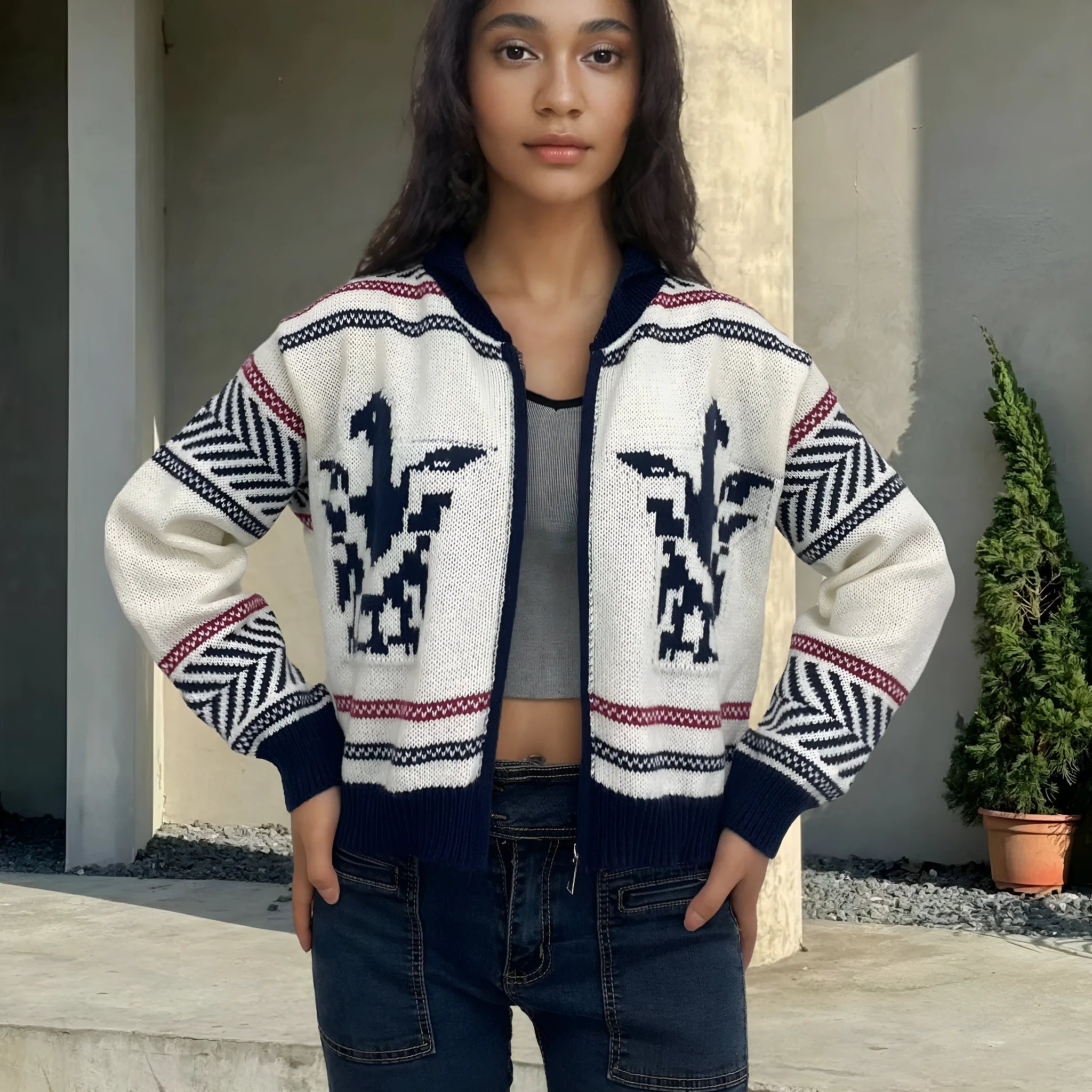 White women's zip-front cardigan with contrast striped jacquard pattern and lapel collar.