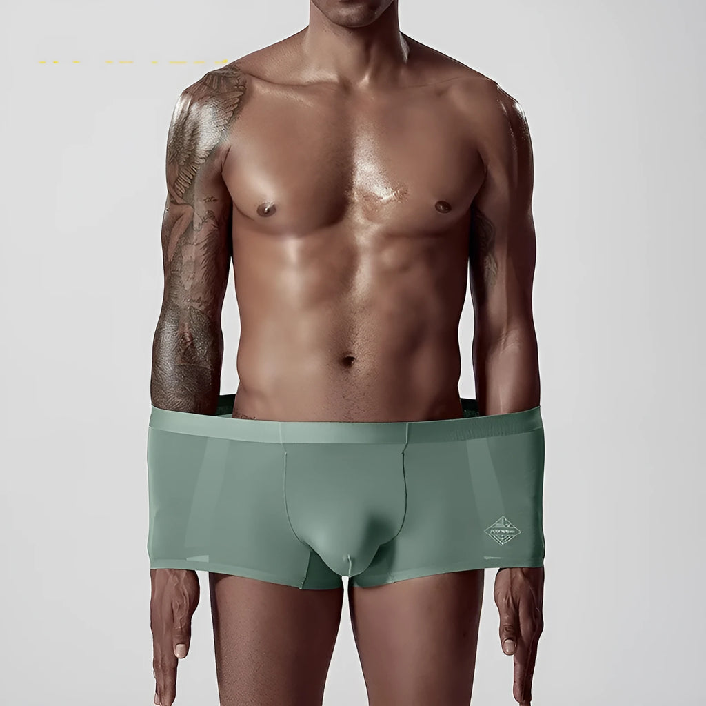 Green seamless modal men's mid waist underwear laid flat
