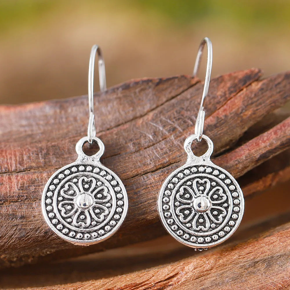 Women's bohemian retro earrings with distressed ethnic round print design in geometric shape