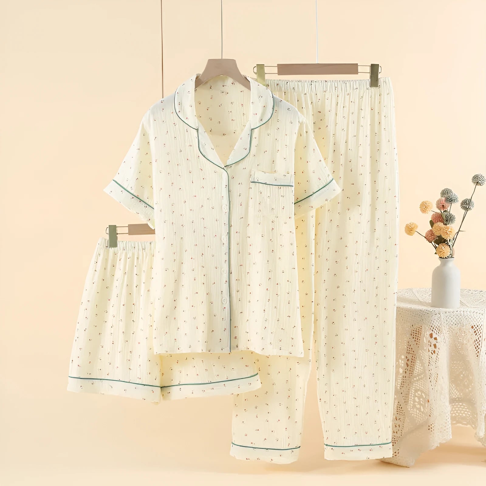 Garden gold women's cotton three-piece pajama set with three-quarter sleeves and lapel detail laid flat.