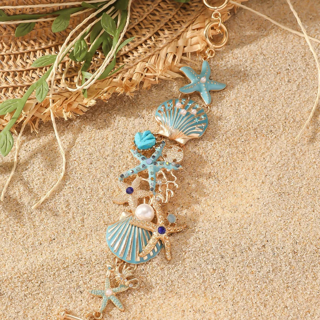 Alloy marine bracelet with boat anchor, star, and starfish rhinestone elements in turquoise, coral red, or coral blue