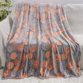 Child's flannel blanket with cartoon pattern draped over an air conditioning unit