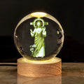 White crystal ball lamp on solid wood base with religious purity designs inside