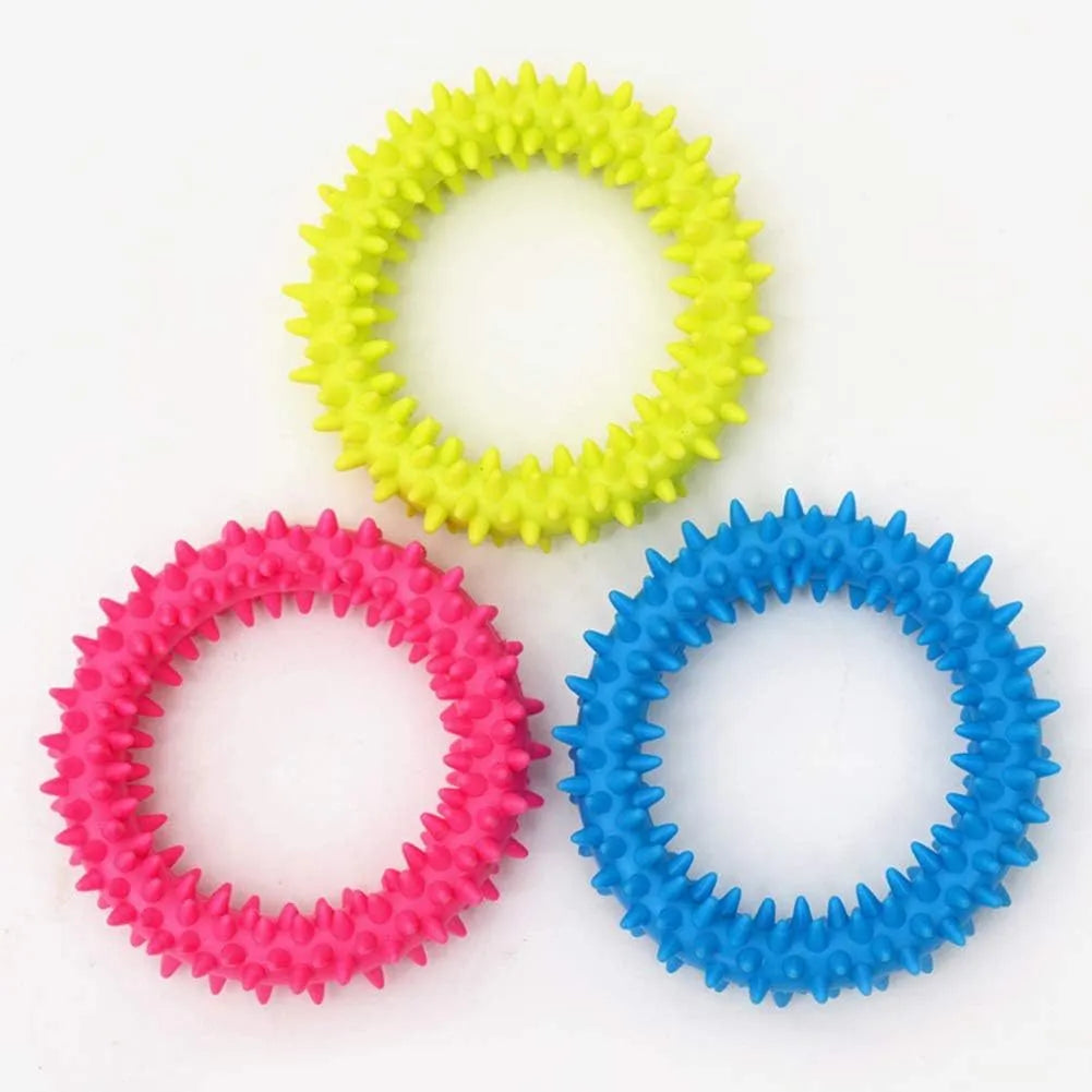 Blue TPR spiky circle dog chew toy on a white background showing dental nubs and ring shape.