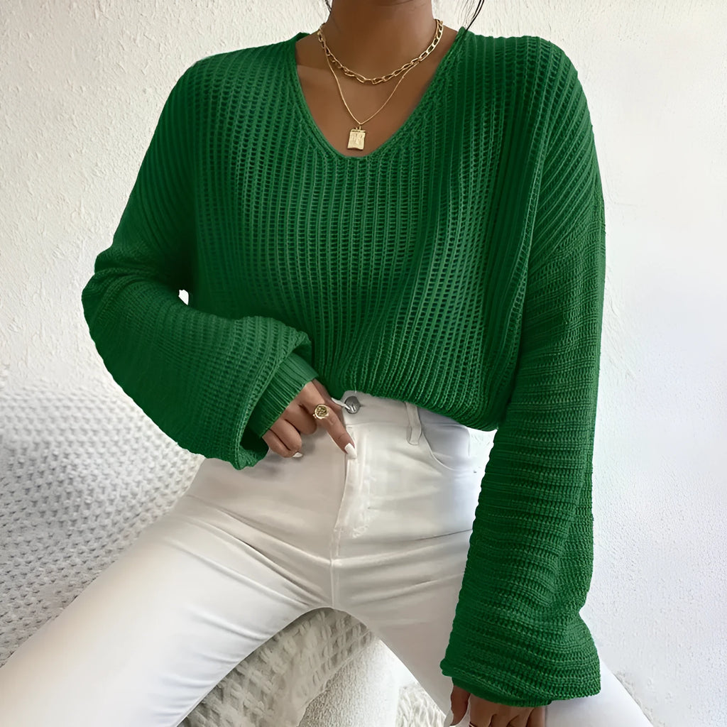 Women's long sleeve polyester pullover top in a solid colour with loose casual fit.