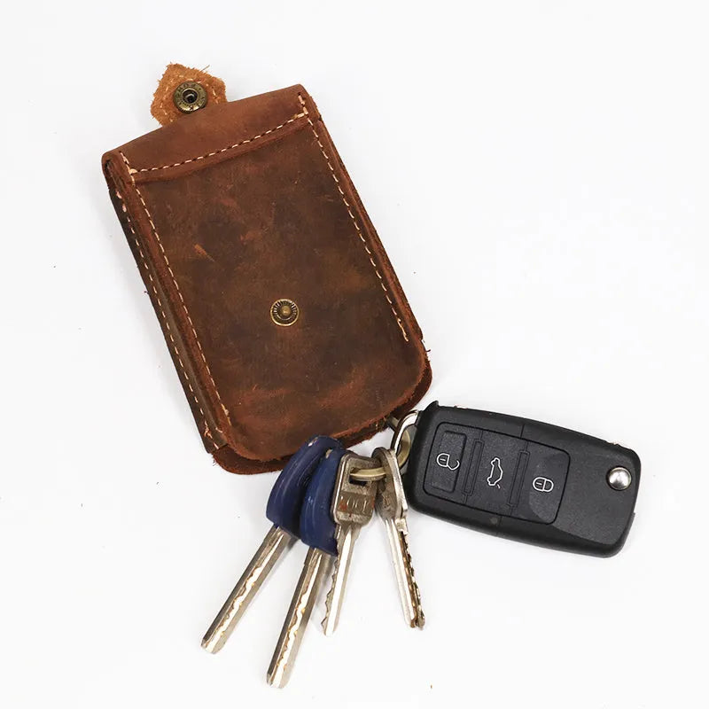 Crazy Horse leather key case in dark brown with keys inserted, measuring 7 cm by 11.5 cm