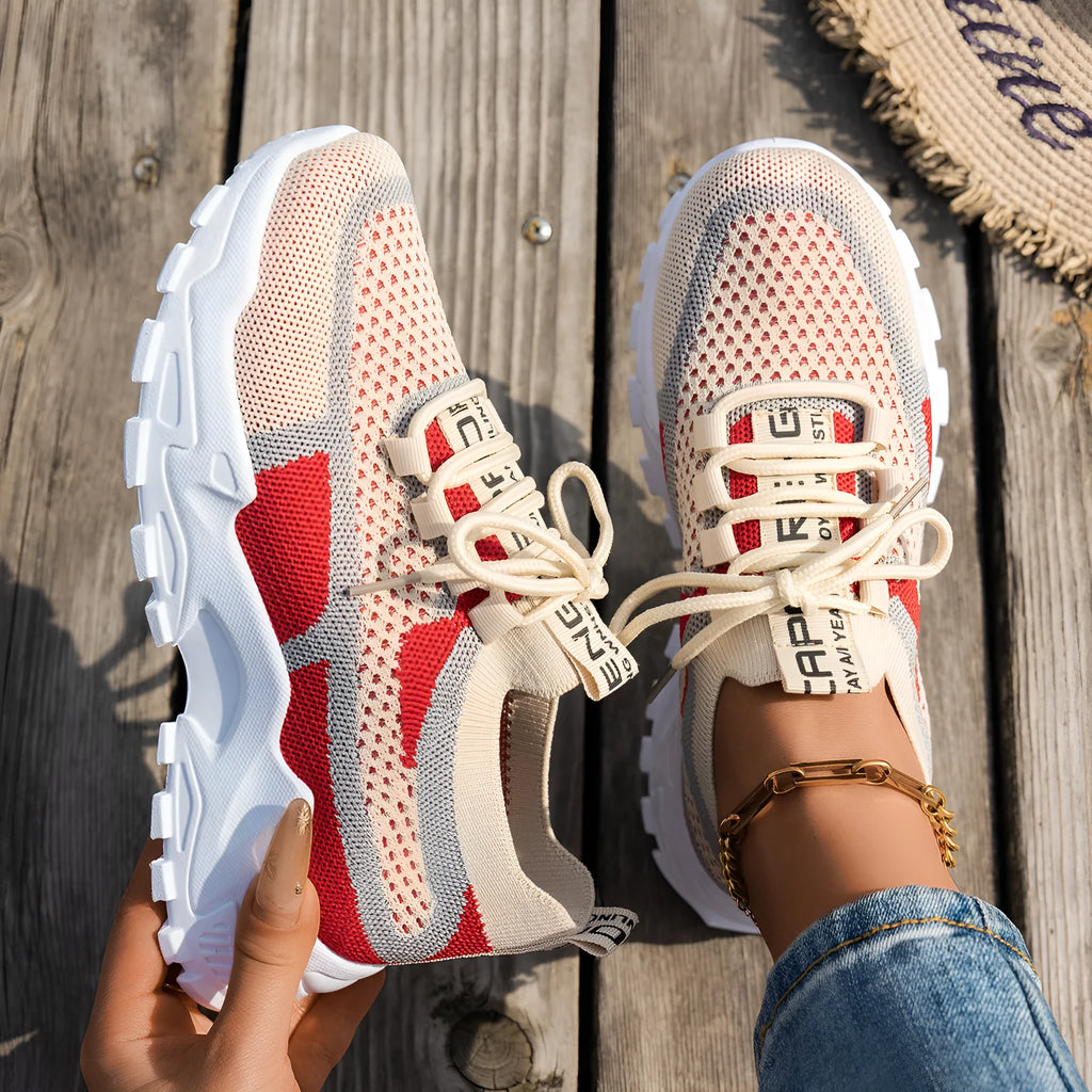 Women's Flyknit mesh lace-up sneakers in various colours with low flat heel and rubber sole